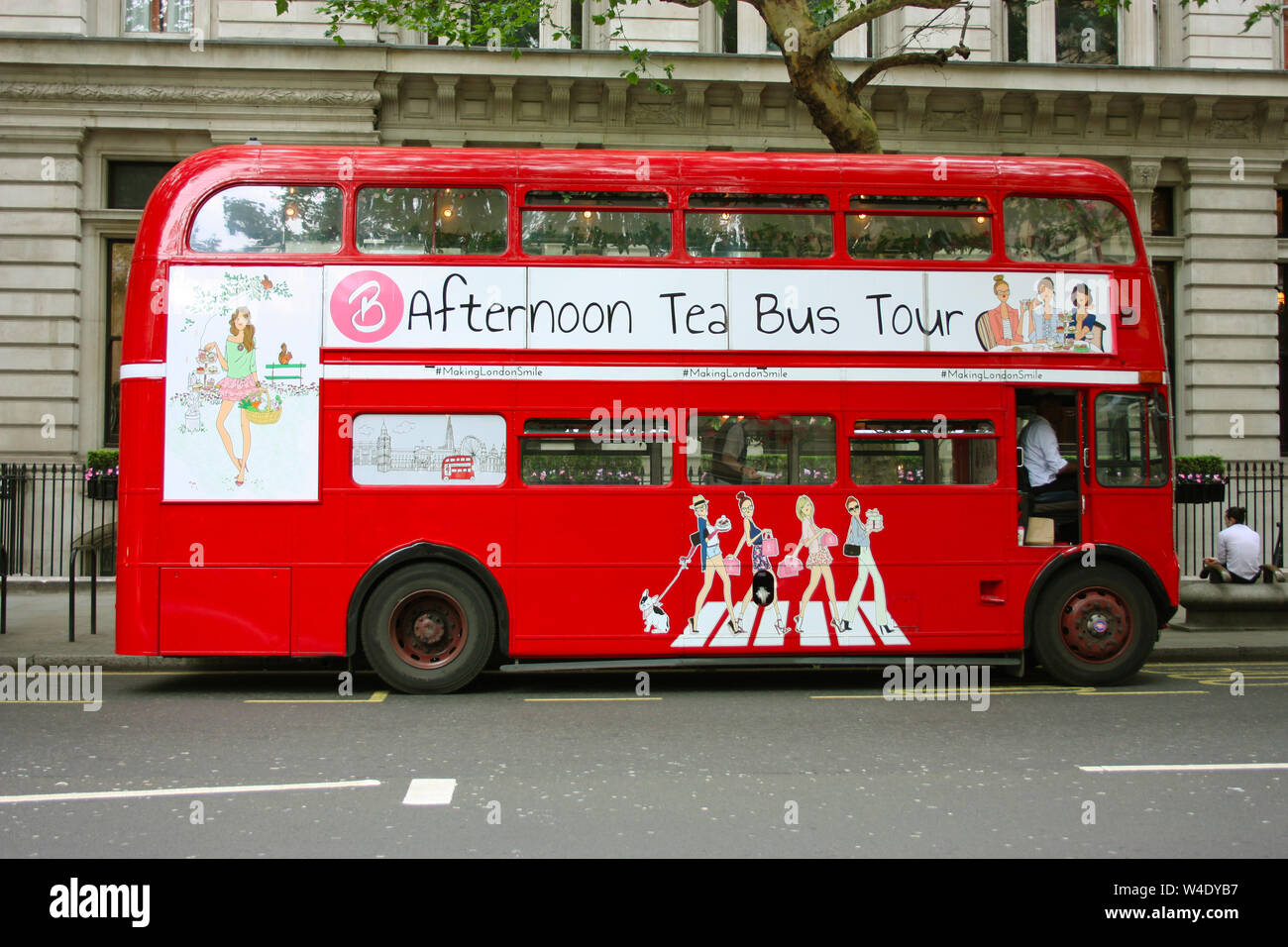the traditional red double-decker London buses in the traffic on the ...