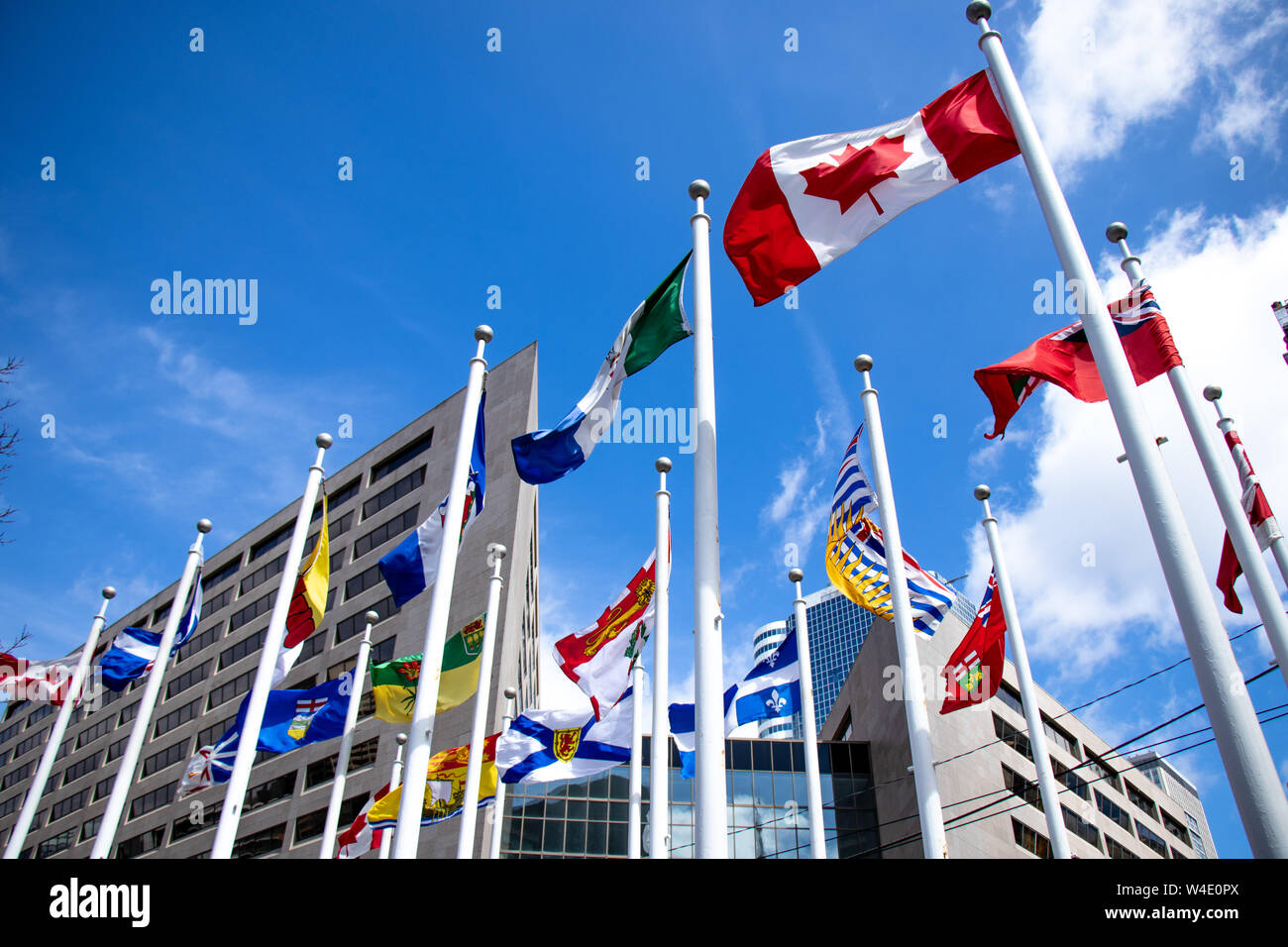 Canadian Flag and Canadian Provincial and Territorial Flags at Nathan Philips Square in front of Toronto City Hall. Stock Photo