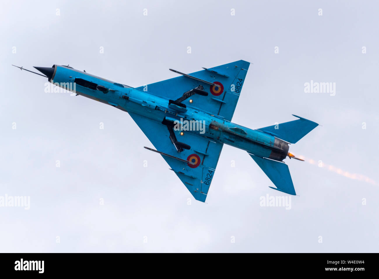 Romanian Air Force MiG-21 LanceR C jet fighter plane flying at Royal International Air Tattoo airshow, RAF Fairford, UK. Vintage Russian Stock Photo