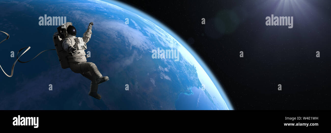 astronaut hovering in orbit of planet Earth Stock Photo