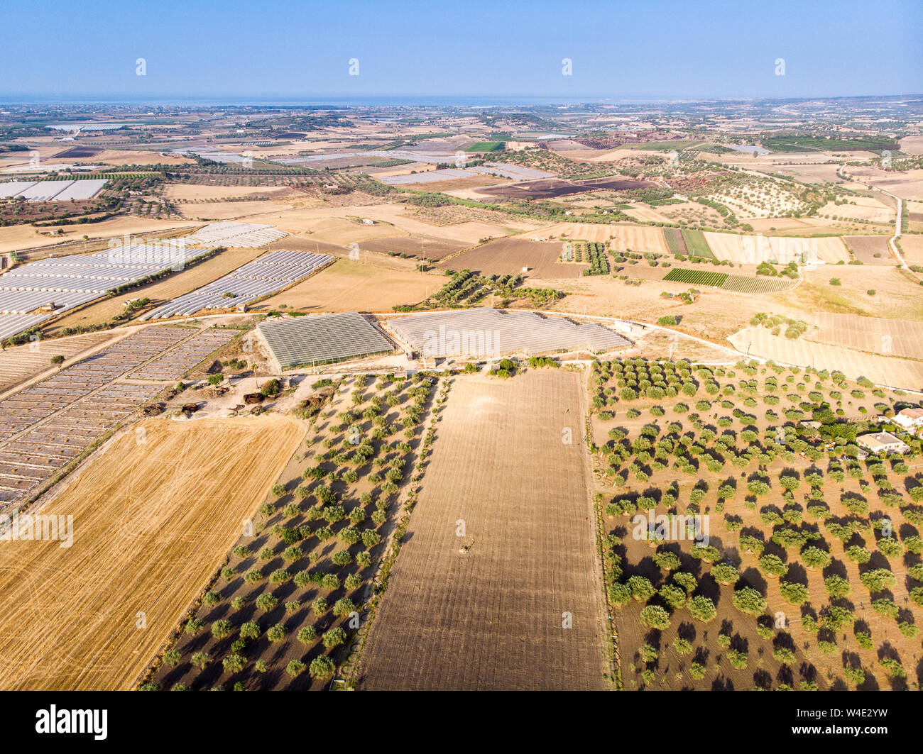 Aerial view of a rural field in the morning The shot is taken in a ...