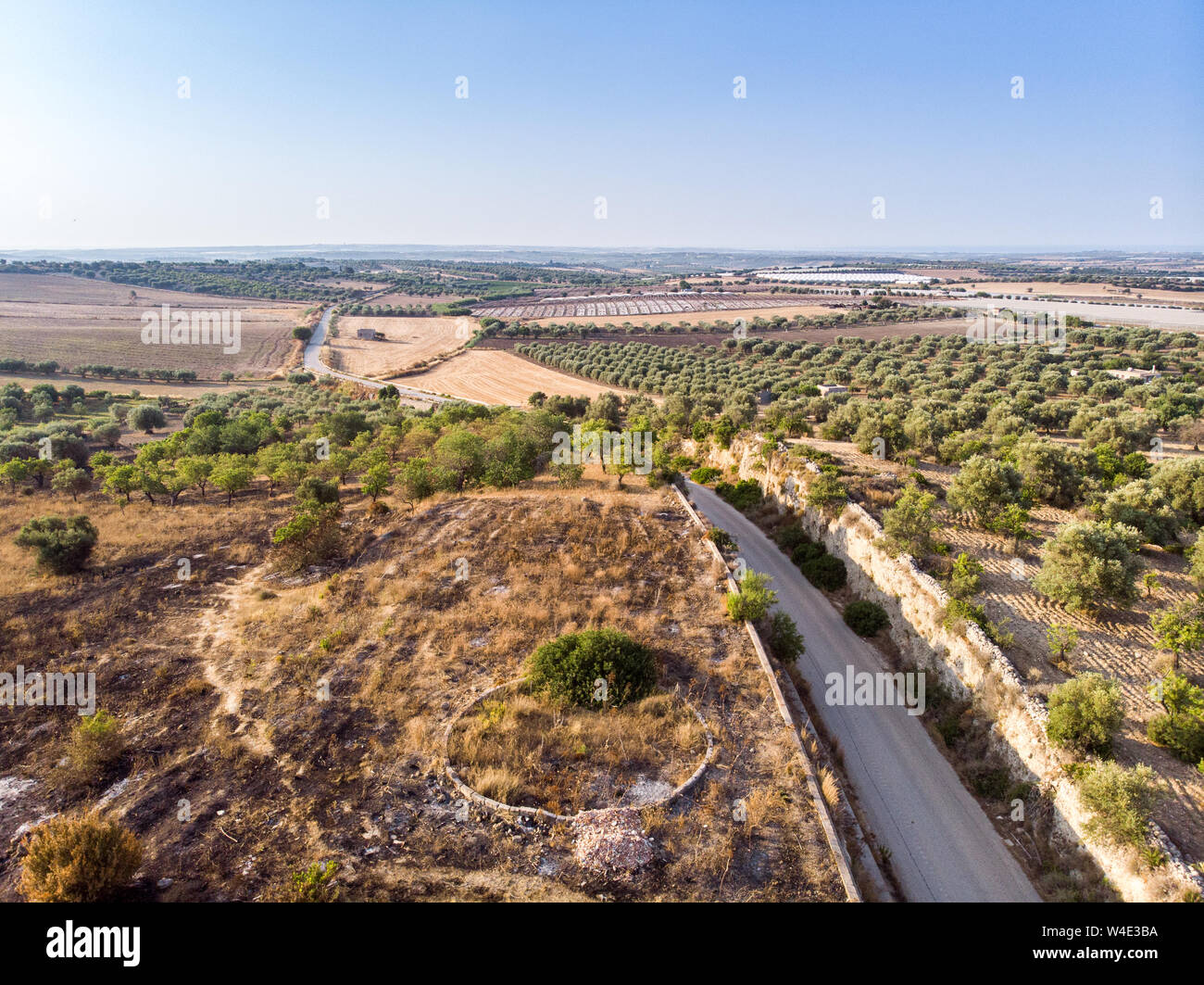 Aerial view of a rural field in the morning The shot is taken in a ...