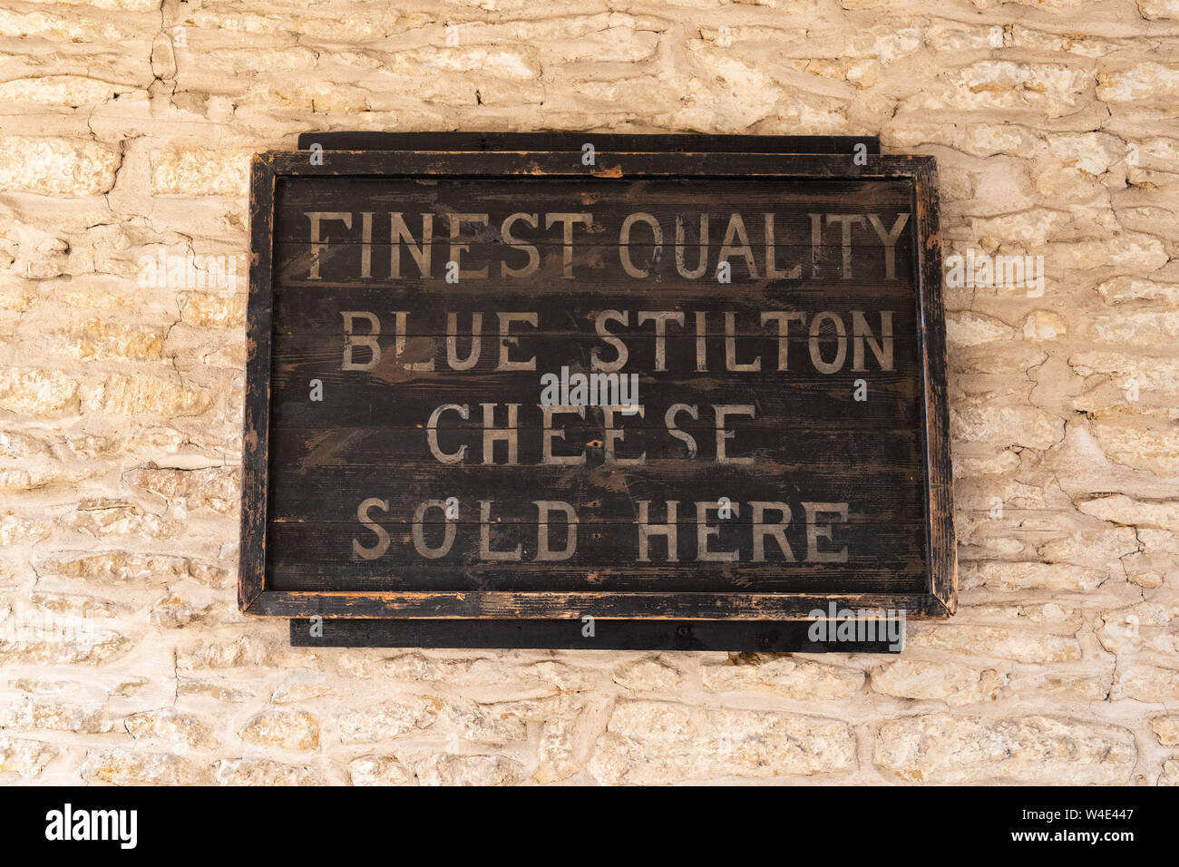 The Bell Inn Hotel, Stilton, Peterborough, England, UK - finest quality blue stilton cheese sold here sign Stock Photo