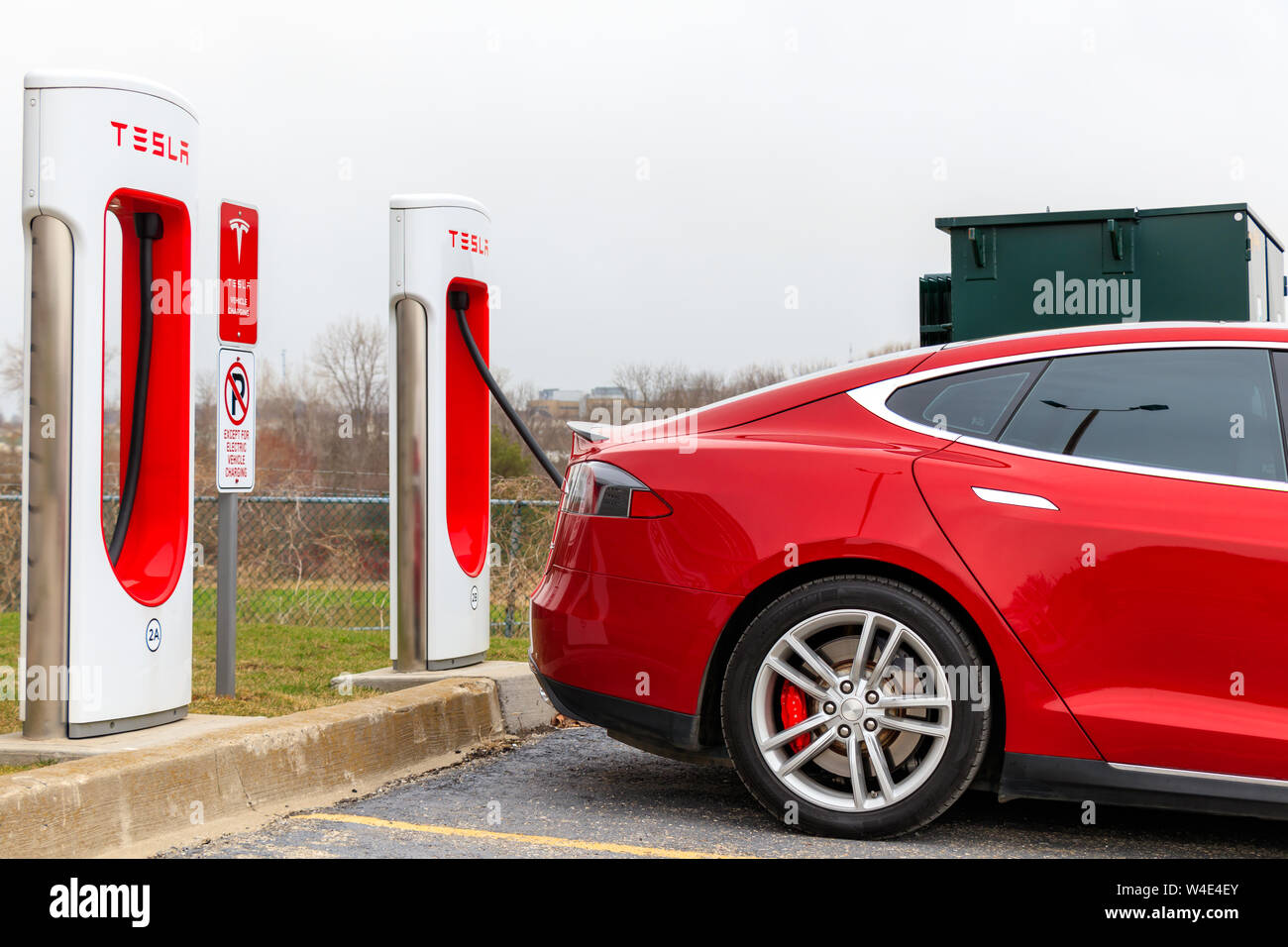 Closeup of Tesla Model S supercharging at Tesla Supercharger location. Stock Photo