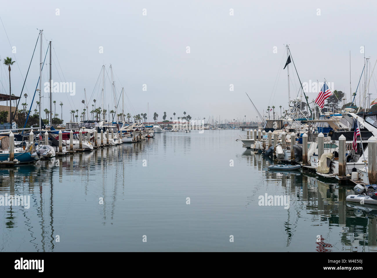Marina with small docked boats. Stock Photo