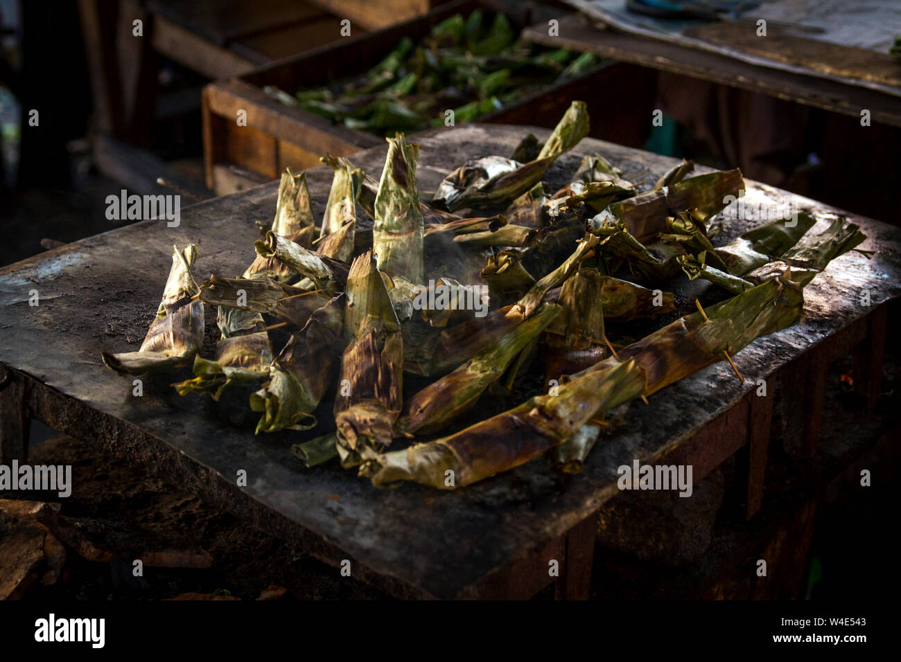 A yummy traditional grill food wrapped in the banana leaf Stock Photo