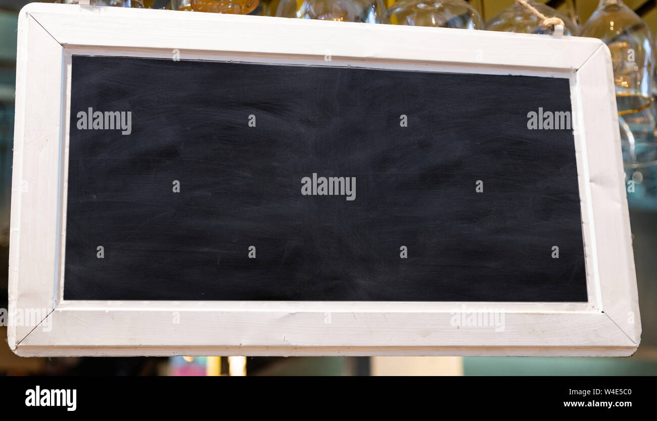 Blank sign, blur bar pub background. Blackboard with wooden frame ...