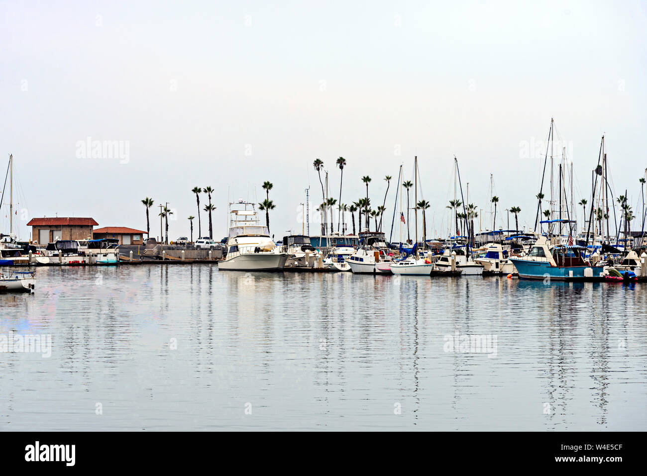 Calm water in a marina with docked boats. Stock Photo