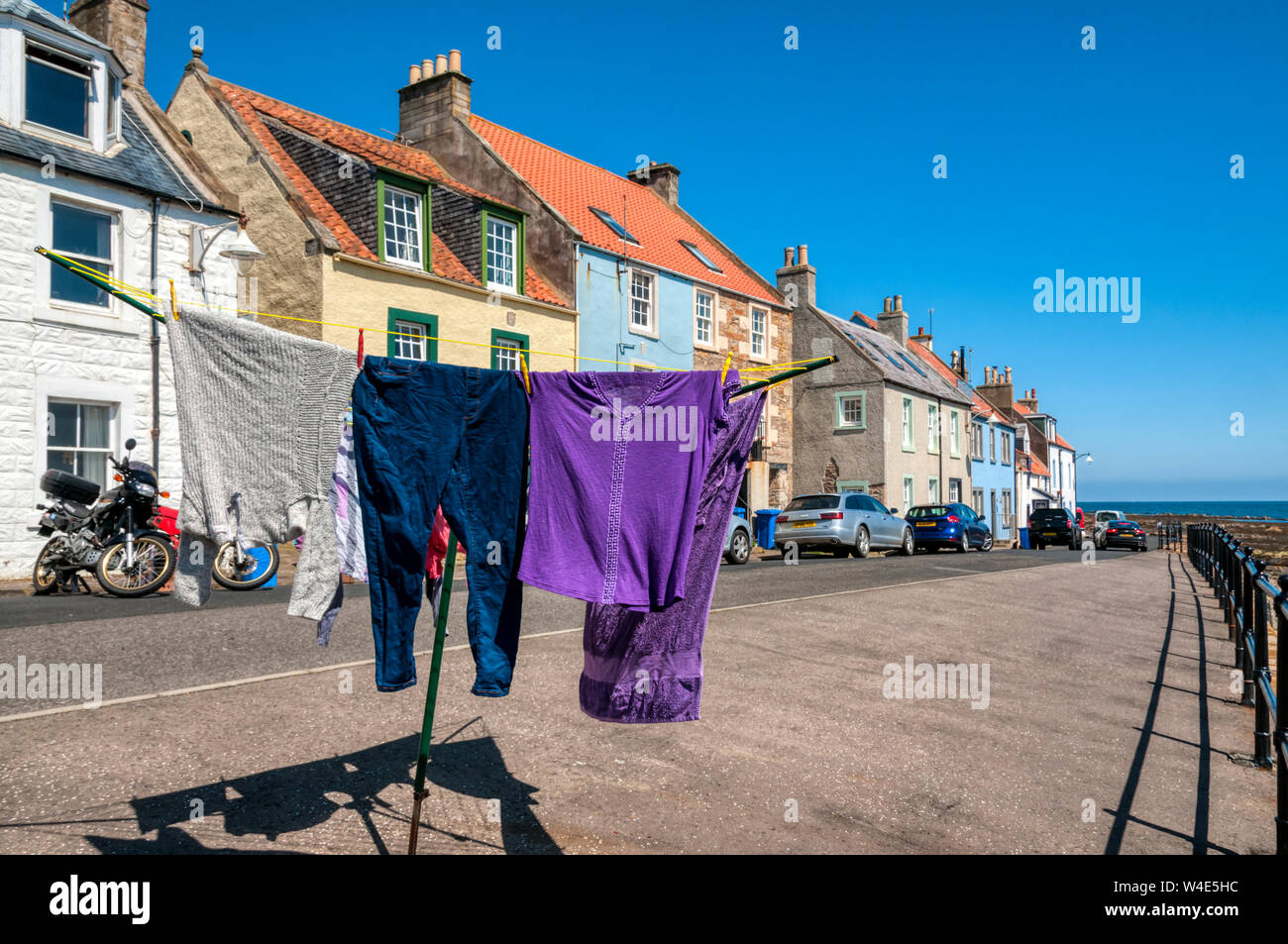 Washing drying on the seafront in the picturesque seaside village St Monans in the East Neuk of Fife, Scotland. Stock Photo