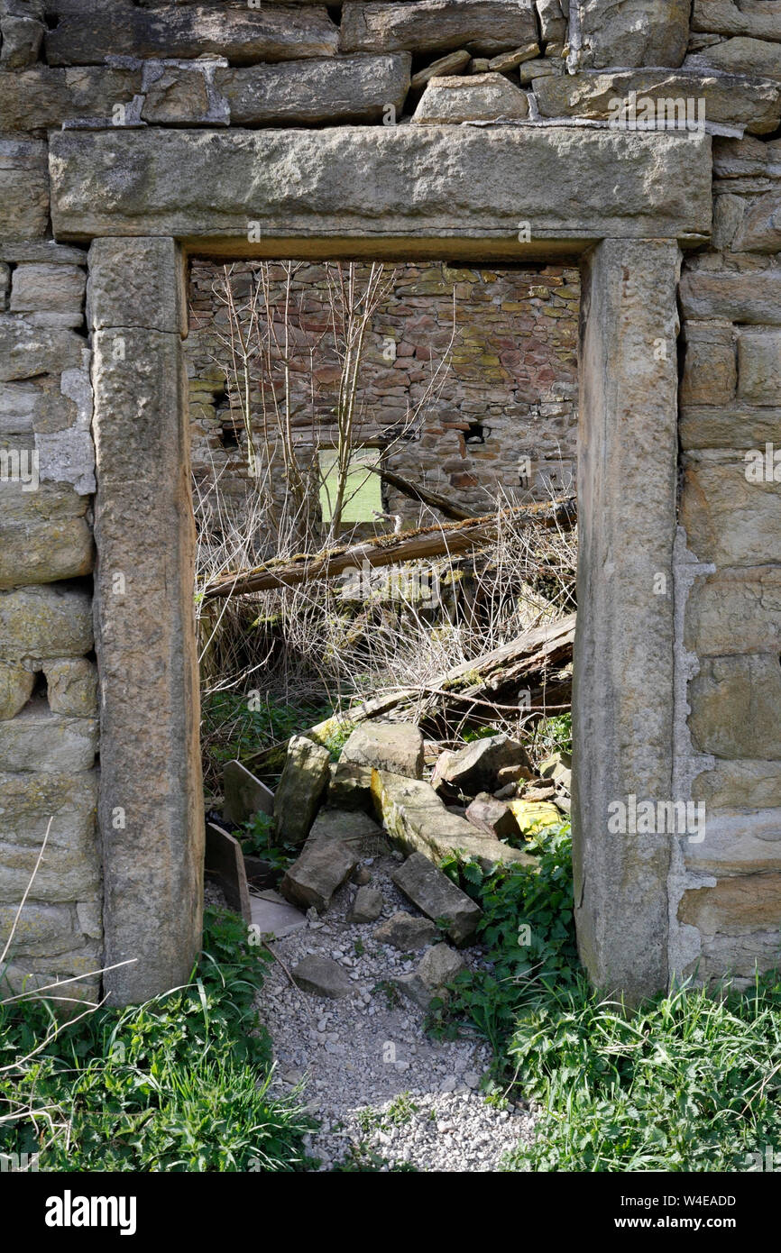 Stone doorway, abandoned farm building, in Derbyshire UK Stock Photo