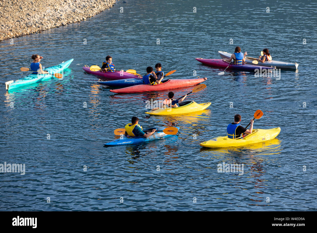 Group of children in colorful kayaks at Strathcona Park Lodge and Outdoor Education Centre in Strathcona Provincial Park, near Campbell River, Vancouv Stock Photo