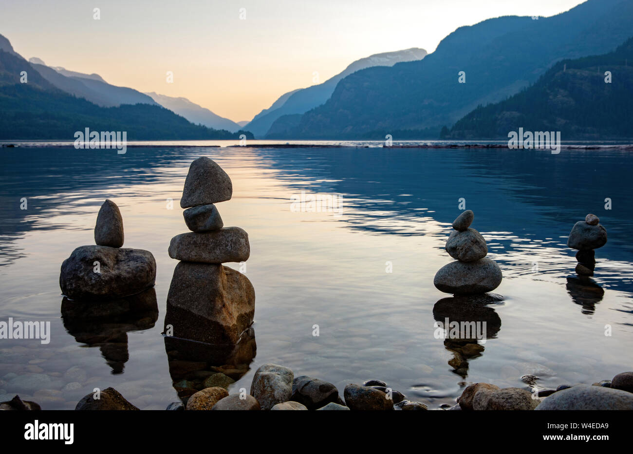 Cairns on the shoreline of Upper Campbell Lake - Strathcona Park Lodge in Strathcona Provincial Park, near Campbell River, Vancouver Island, British C Stock Photo