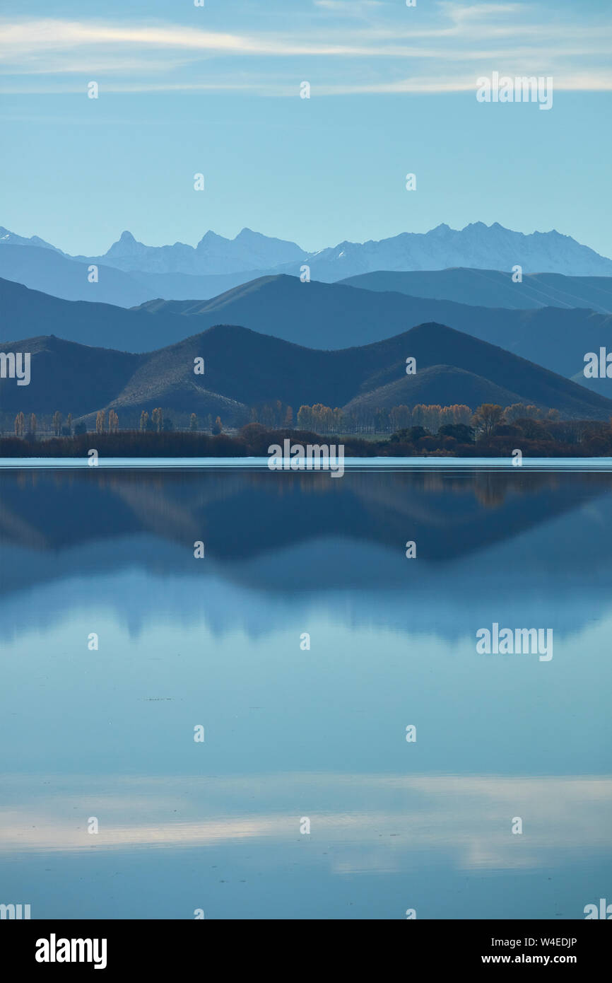 Mountains reflected in Lake Benmore, Waitaki Valley, North Otago, South Island, New Zealand Stock Photo