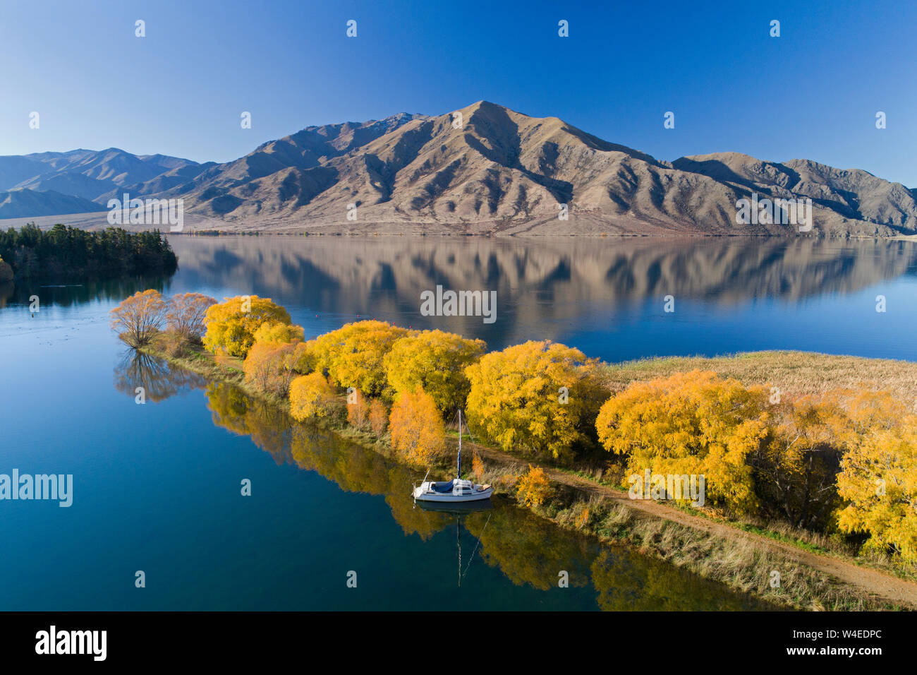 Autumn, Sailors Cutting, Lake Benmore, and Benmore Range, Waitaki Valley, North Otago, South Island, New Zealand - drone aerial Stock Photo