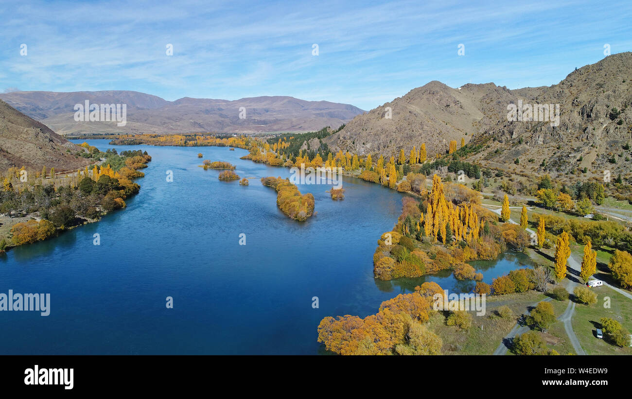 Lake Aviemore, autumn colour, and camp ground, Waitaki Valley, North Otago, South Island, New Zealand - drone aerial Stock Photo
