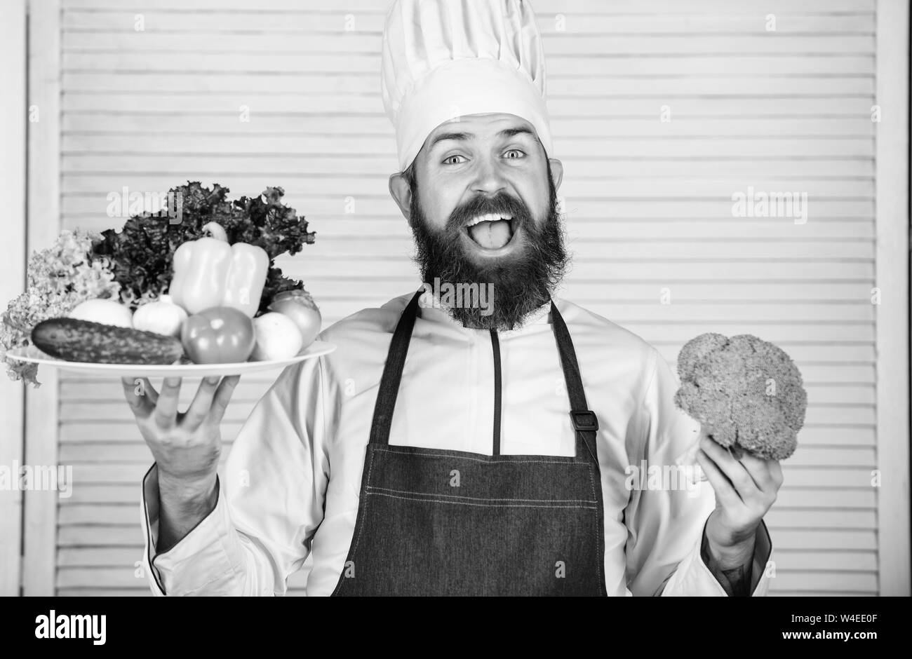 Man happy presenting excellent vegetables. Organic culinary recipe ...