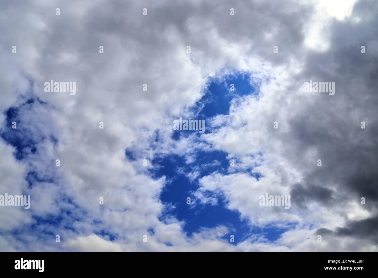 Beautiful white fluffy clouds on a deep blue sky Stock Photo - Alamy
