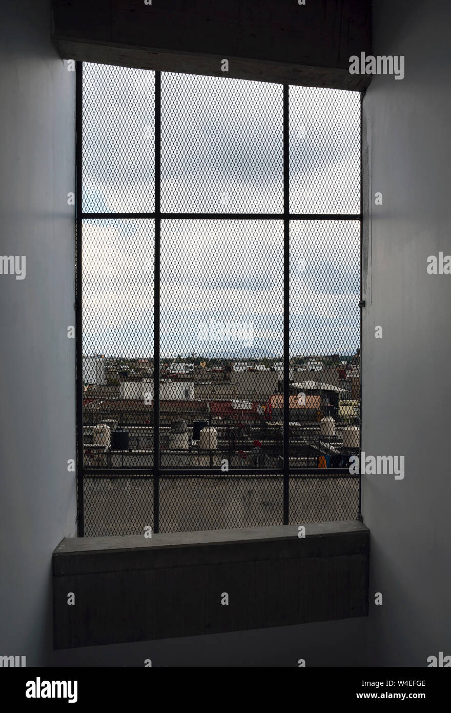 Interior window with bars overlooking to Mexico City, CDMX, Mexico, Jun 2019 Stock Photo