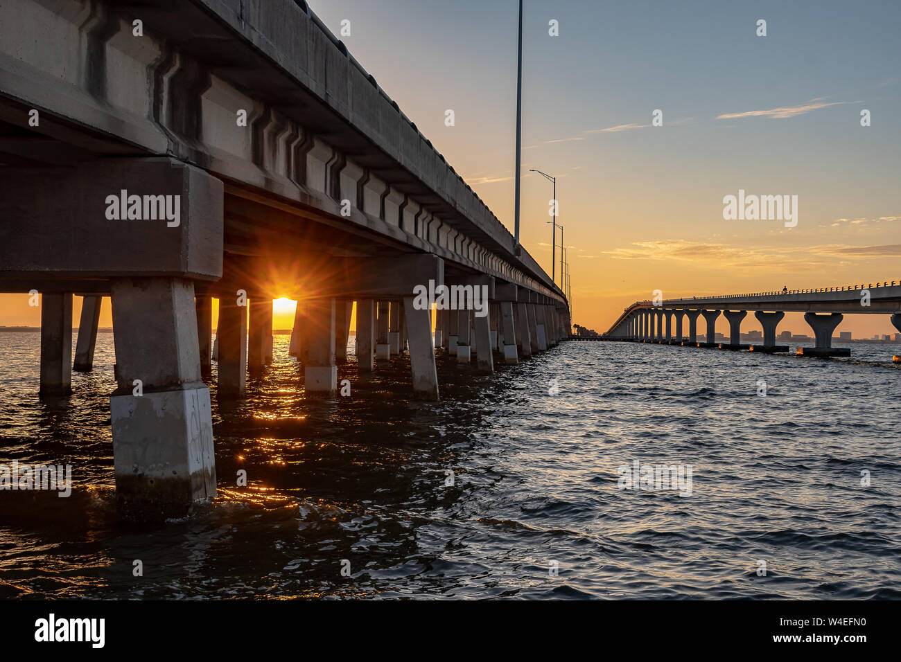 Sunrise under the bridge with a view of the Tampa Bay in Florida Stock Photo