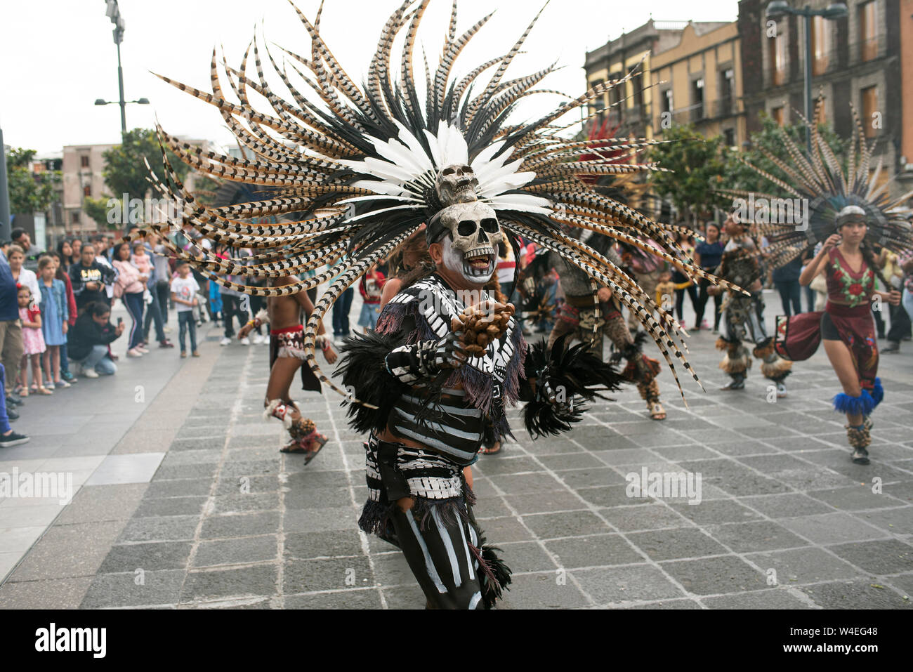 Aztec dancers (concheros) performing ritual dance at the Zocalo, Mexico City, CDMX, Mexico. Jun 2019 Stock Photo