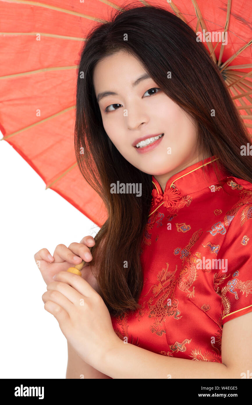 Beautiful Chinese Woman Wearing A Traditional Dress Known As A Cheongsam Or Chipao Isolated On A