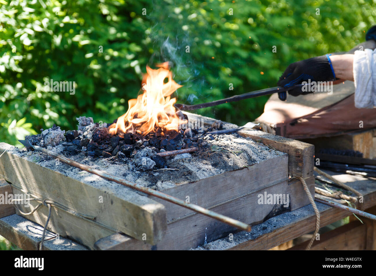 Forge. Blacksmith's tool. Old blacksmith's hand oven. Heating of metal by the old method. Stock Photo