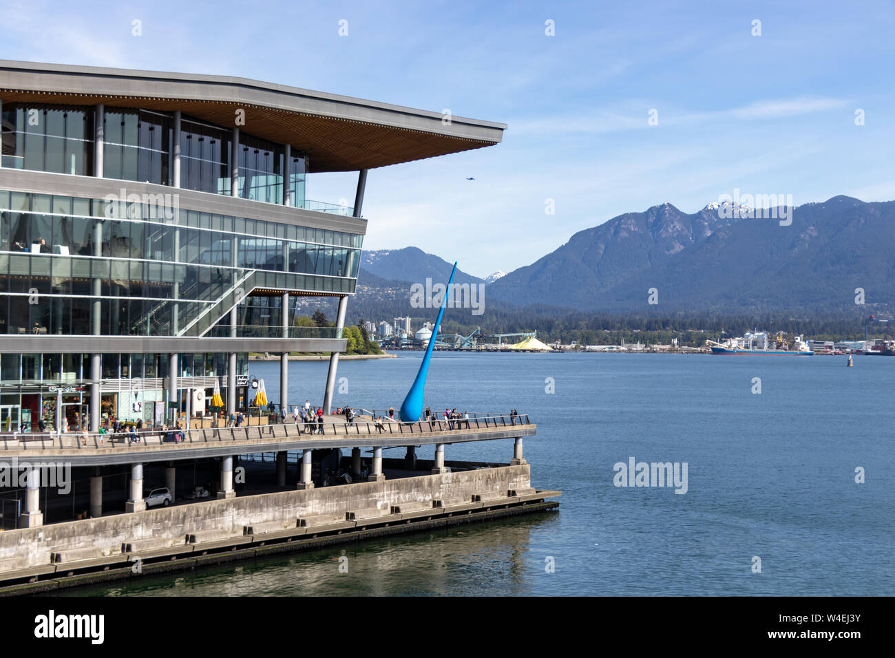 Burrard Landing at the Port of Vancouver seen with some industrial facilities across the harbour in the background on a beautiful spring day. Stock Photo