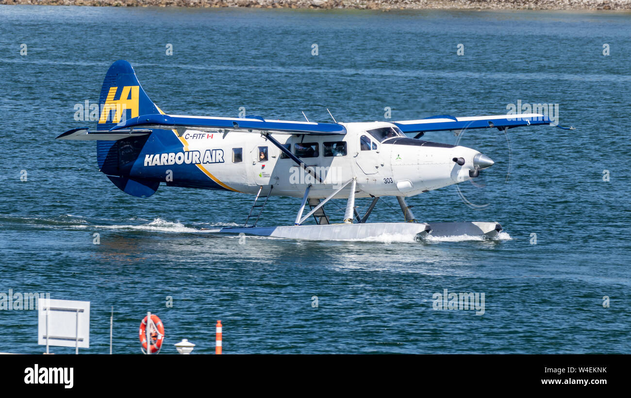 Harbour Air seaplane seen taxiing from in Vancouver, BC's Harbour Airport for takeoff. Stock Photo