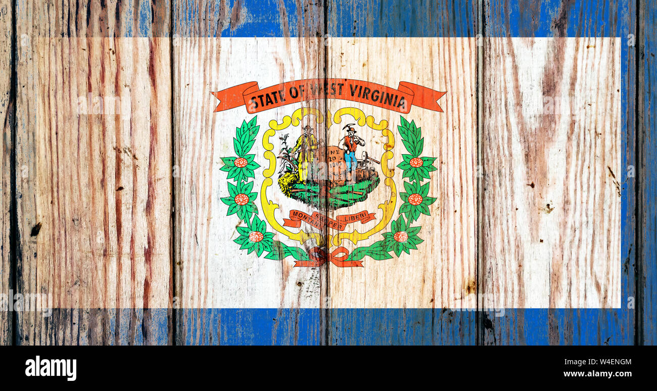 West Virginia US state national flag on a gray wooden boards background ...