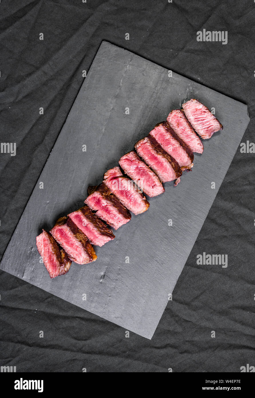 New york strip porterhouse steak beef meat with garnished and spices