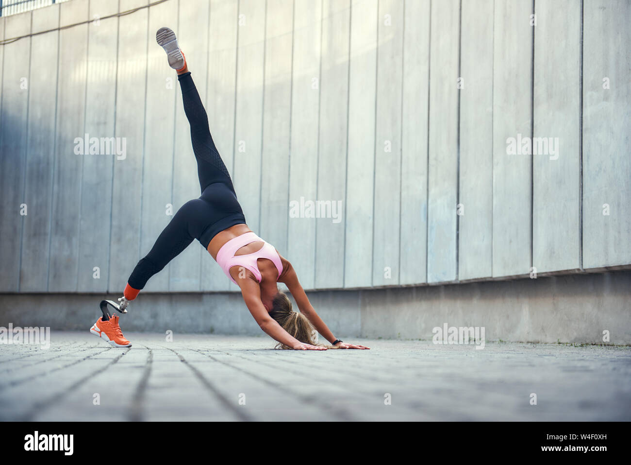 Balance and flexibility. Full-length of young disabled woman with leg  prosthesis in sportswear doing yoga asana outdoors. Disabled sport concept.  Motivation. Healthy lifestyle Stock Photo - Alamy