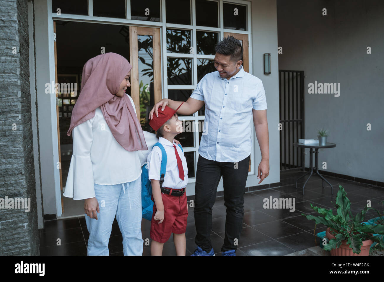 parent take kid to school in the morning Stock Photo Alamy