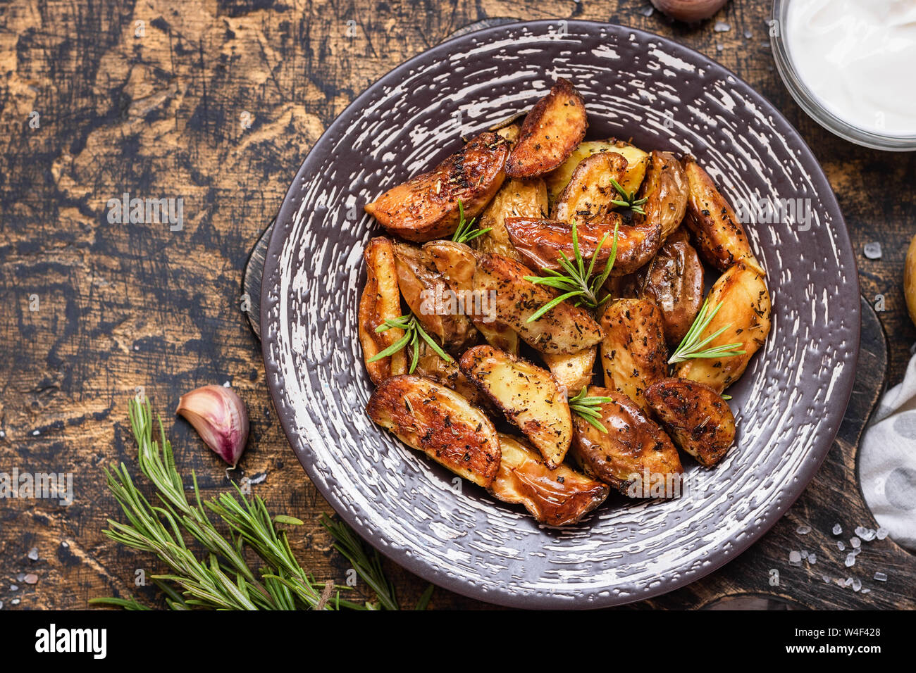 Baked young potatoes in a rustic style with rosemary, garlic and sumac ...