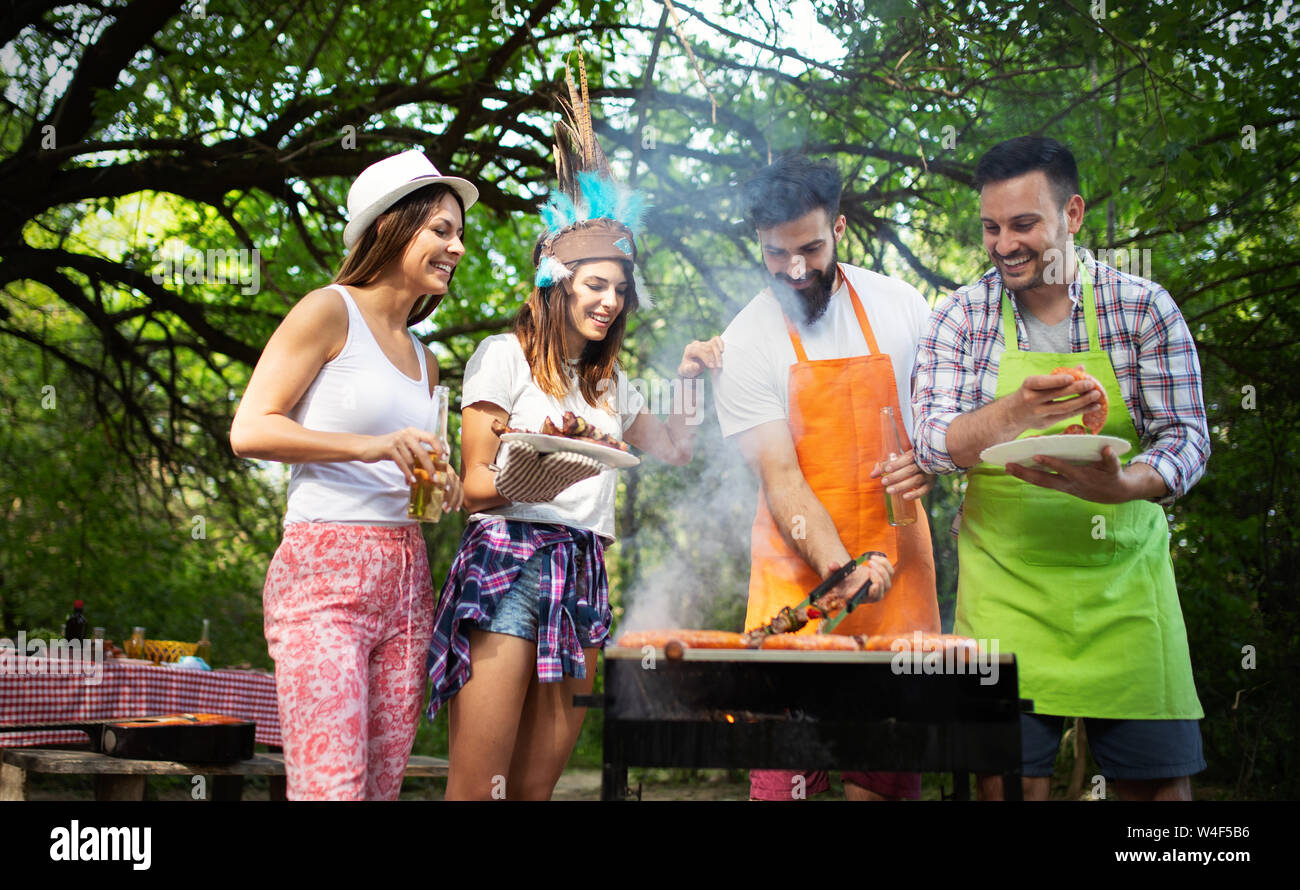Group of friends having a barbecue party in nature Stock Photo - Alamy