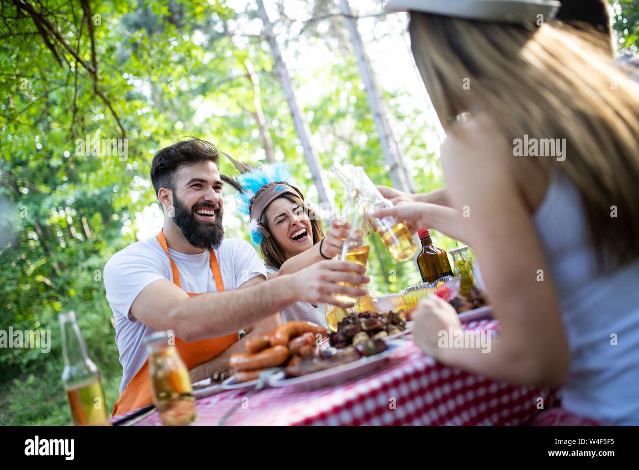 Group of friends having a barbecue party in nature Stock Photo - Alamy