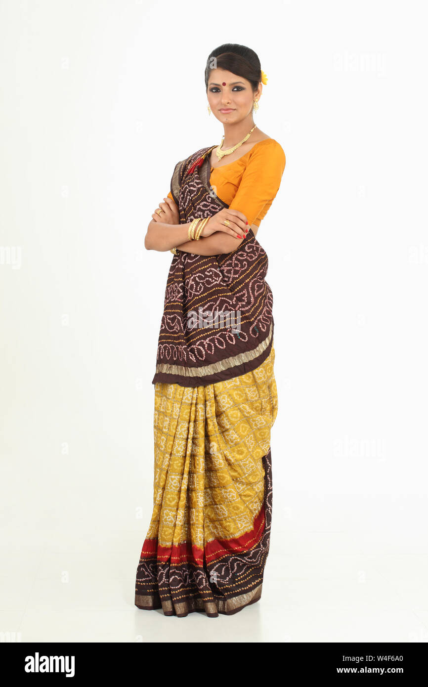 Woman standing with her arms crossed Stock Photo - Alamy