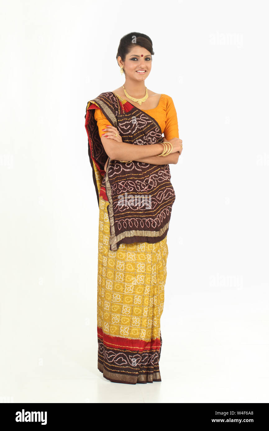 Woman standing with her arms crossed and smiling Stock Photo - Alamy