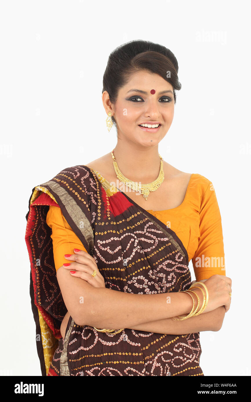 Woman smiling with her arms crossed Stock Photo - Alamy