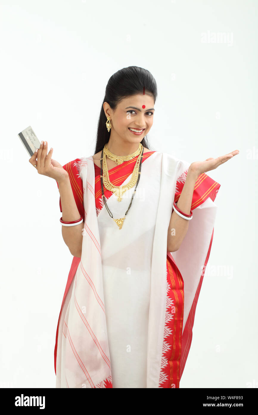 Bengali woman showing a credit card and smiling Stock Photo