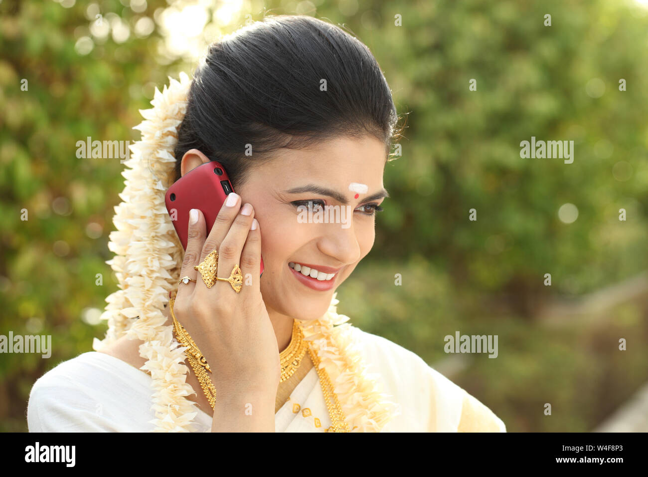 South Indian woman talking on mobile phone Stock Photo - Alamy