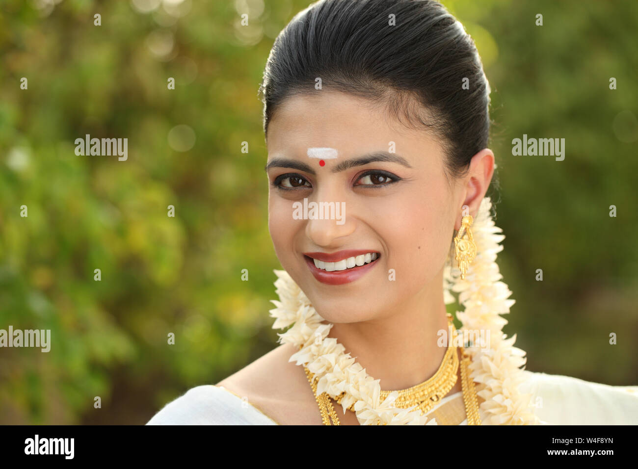 Portrait of a south Indian woman smiling Stock Photo - Alamy