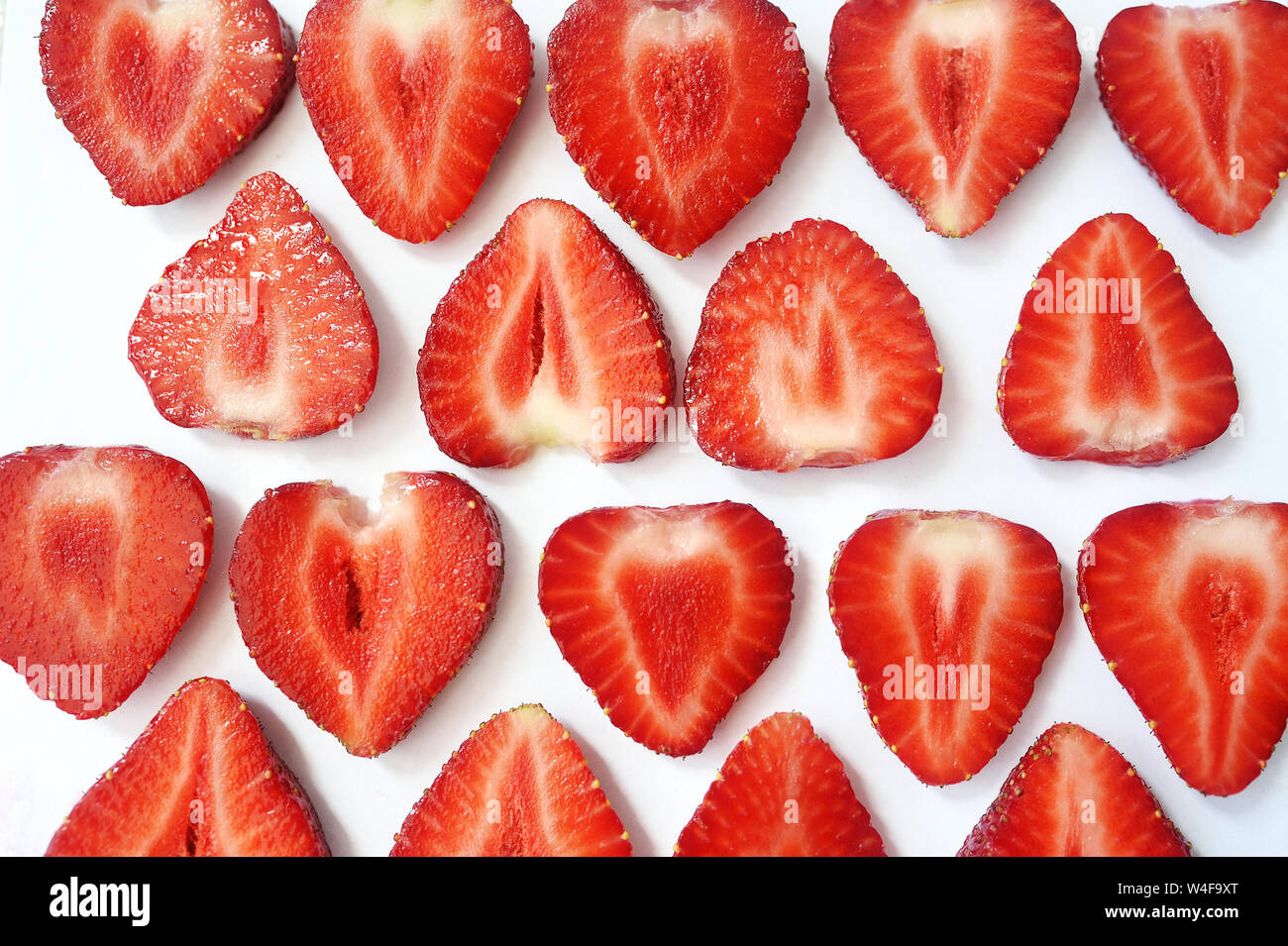 Strawberry slice red background texture. Top view. Concept of summer eco  food Stock Photo - Alamy