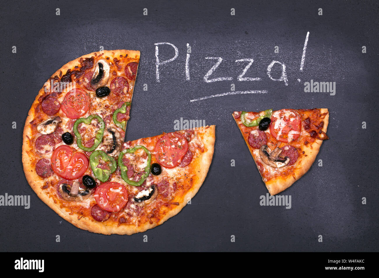 Pizza on chalkboard, with the word Pizza written in chalk. Stock Photo