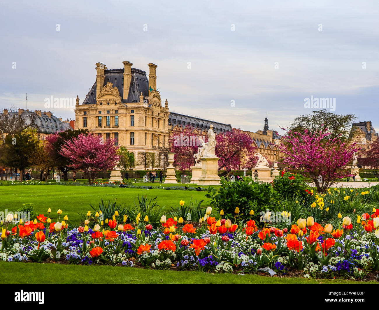 Marvelous spring Tuileries garden and view at the Louvre Palace in Paris France. April 2019 Stock Photo