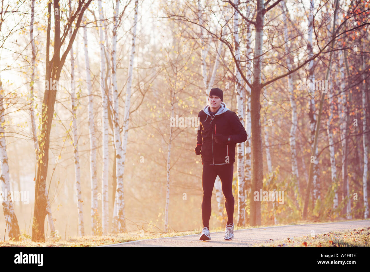 Man running at autumn morning Stock Photo