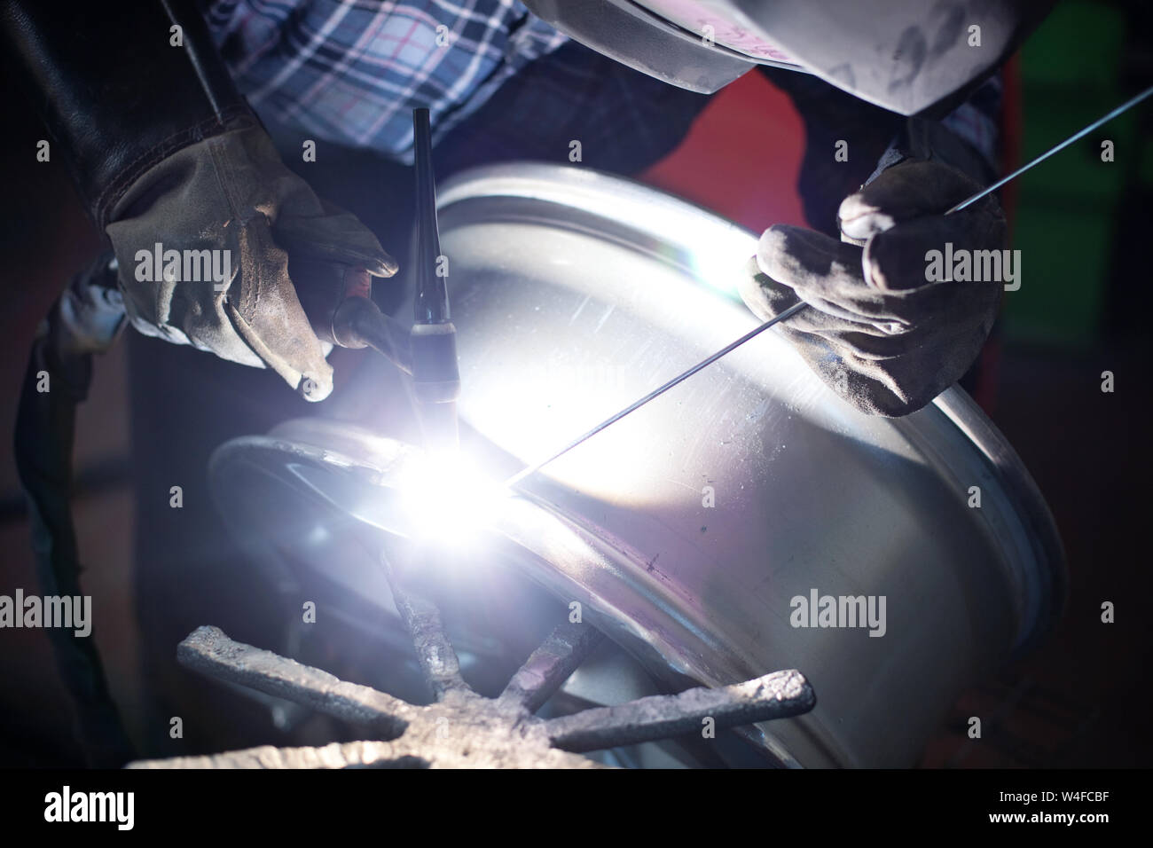Welding alloy rim. Alloy wheel repair Stock Photo Alamy