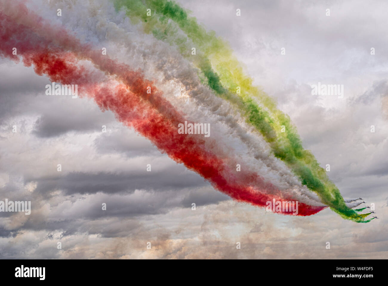 Largest Italian flag painted in the sky by Frecce Tricolori coloured smoke at Royal International Air Tattoo airshow, RAF Fairford, Cotswolds, UK. Stock Photo