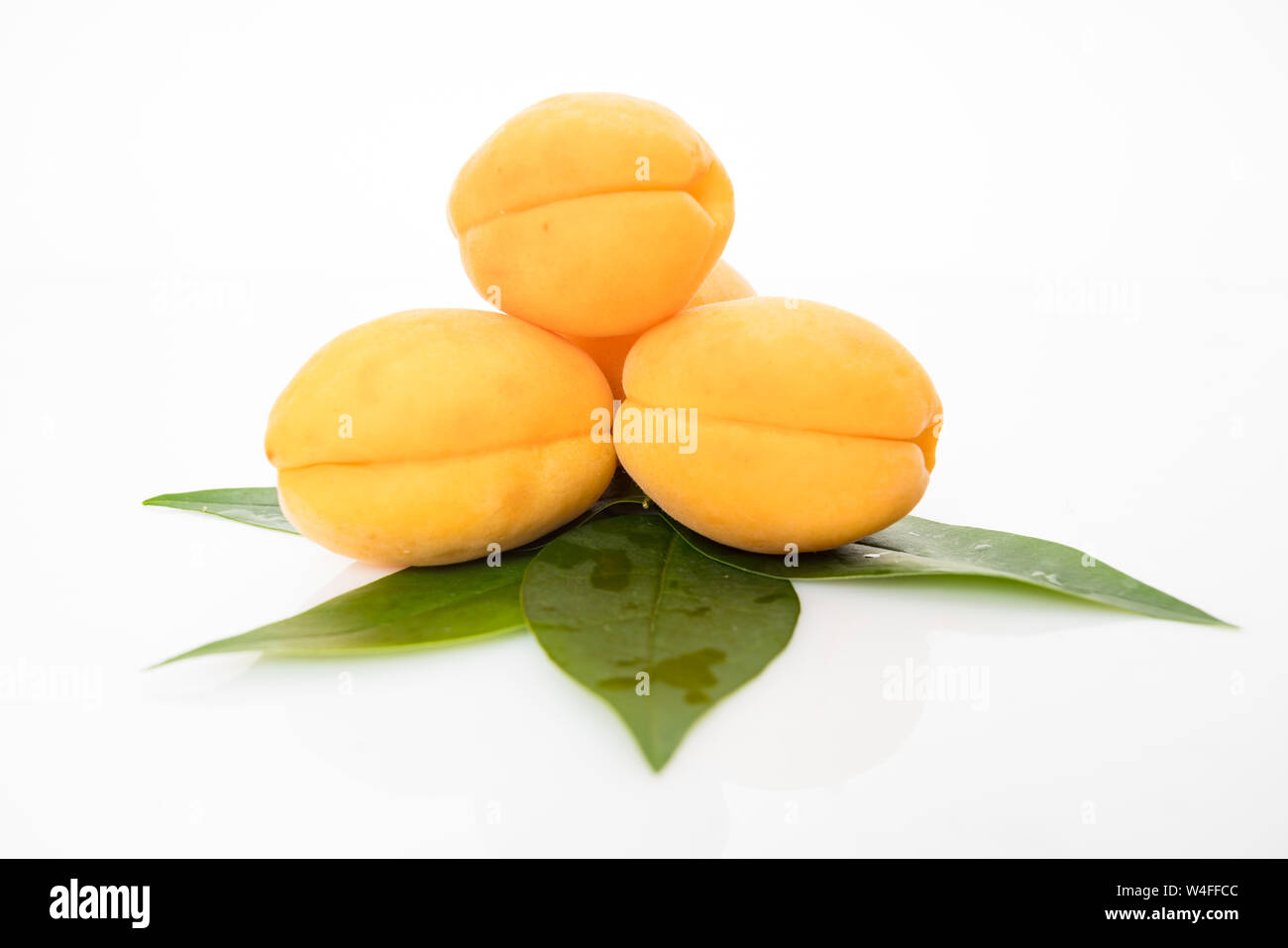 Apricot fruit with leaf isolated on white background Stock Photo - Alamy