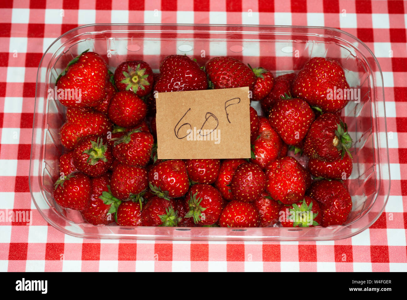 Garden grown strawberries sold at a village fate Stock Photo