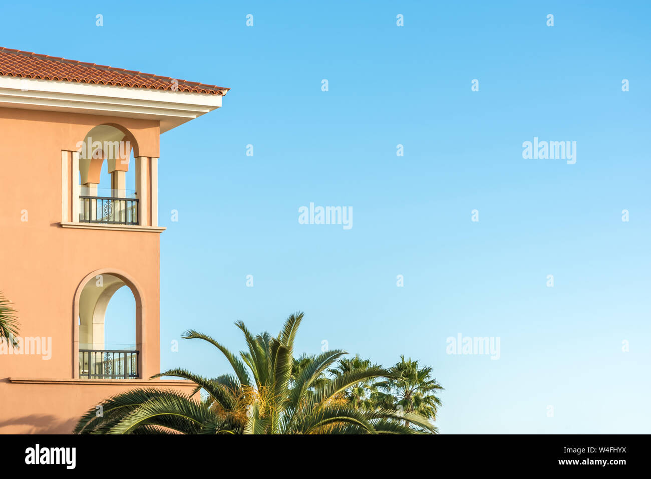 Part of a luxurious house in mediterranean style with palm trees and ...
